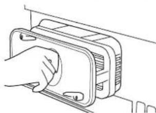 Line drawing of a hand inserting a component into a device housing (no text or symbols)