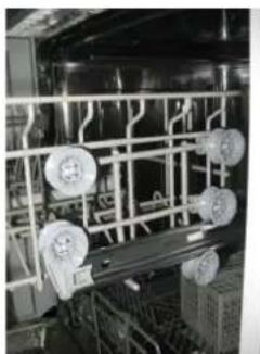 Interior view of an industrial control room with overhead piping and circular components (no visible text or symbols)
