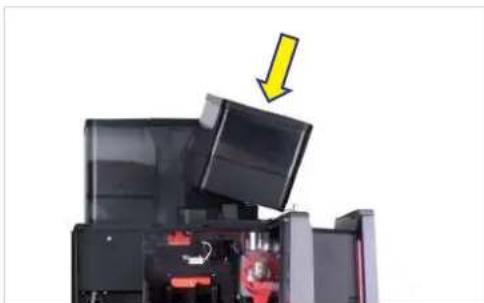 Interior view of a device with open doors and internal components, featuring a yellow arrow pointing downward (no text or symbols visible).