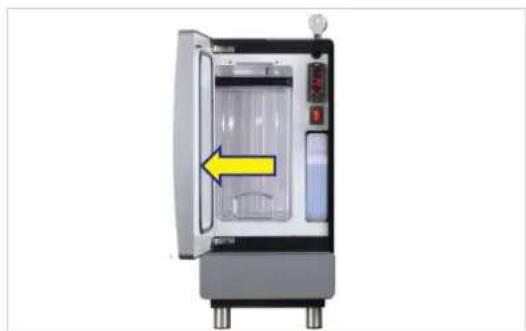Interior view of a laboratory appliance with a yellow arrow pointing to the door (no text or symbols visible)