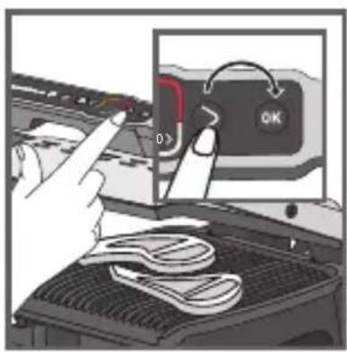 Diagram showing a hand pressing a button labeled 'OK' on a device, with a close-up of the button's handle and a tool on the screen.
