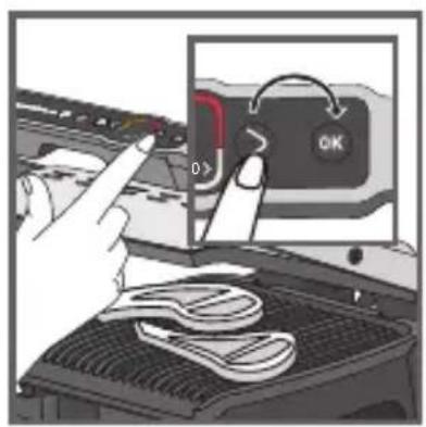 Diagram showing a hand pressing down on a component with a lock labeled 'OK' and a red control knob, alongside a photo of a meat being processed.