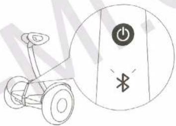 Diagram showing a motor with power button and Bluetooth symbol, alongside a magnified view of the device's electrical function.