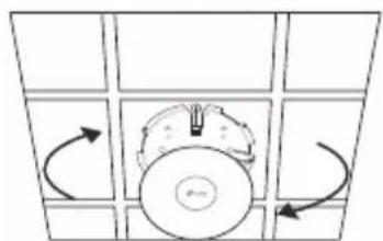 Diagram of a circular object with directional arrows indicating rotation or movement, surrounded by grid panels (no text or symbols)