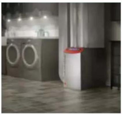 Interior view of a modern kitchen with washing machines and a trash bin (no visible text or symbols)