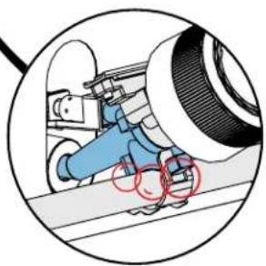 Illustration of a mechanical device with blue components and red circular elements, enclosed in a circular frame (no text or symbols)