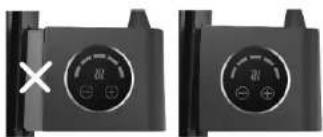 Two black industrial control panel buttons with circular indicators and a white X mark, no text or symbols present.