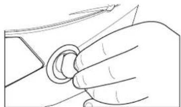 Line drawing of a hand holding a circular object with a pointer (no text or symbols)