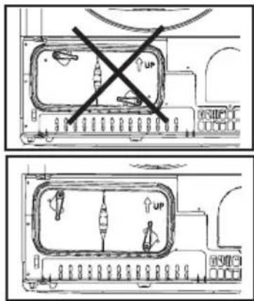 Diagram showing two layout scenarios with 'UP' symbols and a crossed-out X mark, likely indicating parking or ventilation rules.