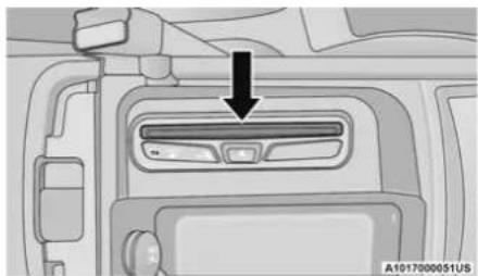 Interior view of a car dashboard with a black arrow pointing to the intake section (no text or symbols visible)
