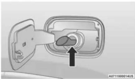 Diagram of a car interior showing a plug inserted into a housing with an arrow pointing to the plug (no text or symbols present)