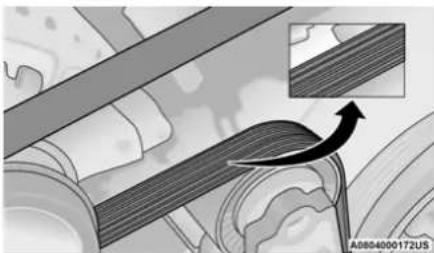 Mechanical assembly diagram showing layered components with an inset view of a curved arrow indicating motion (no text or symbols)