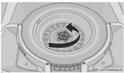 Technical diagram of a mechanical component with concentric rings and central slots (no text or symbols)