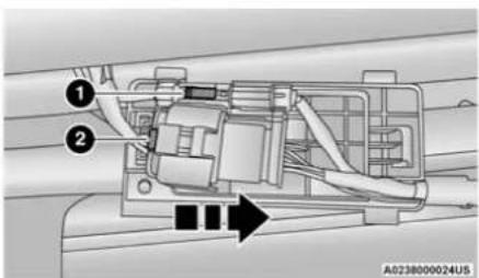 Technical diagram of a vehicle's internal components with numbered parts and directional arrow