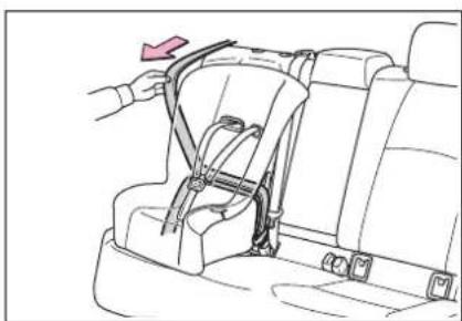 Line drawing of a car interior showing a seatbelt buckle being lifted by a hand (no text or symbols)