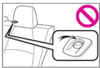 Diagram showing car seatbelt with no stop sign and a magnified inset highlighting the seatbelt area.