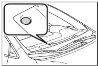 Line drawing of a car interior with a highlighted rectangular object (no text or symbols)