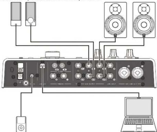 Diagram showing audio equipment connections between a computer and a laptop, with labeled components and connections.