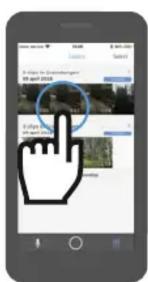Mobile app screenshot showing a hand cursor icon interacting with a circular interface, likely for navigation or search.