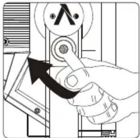 Diagram showing a hand pressing a valve with a hammer symbol and an arrow indicating clockwise motion, likely illustrating electrical or mechanical control.