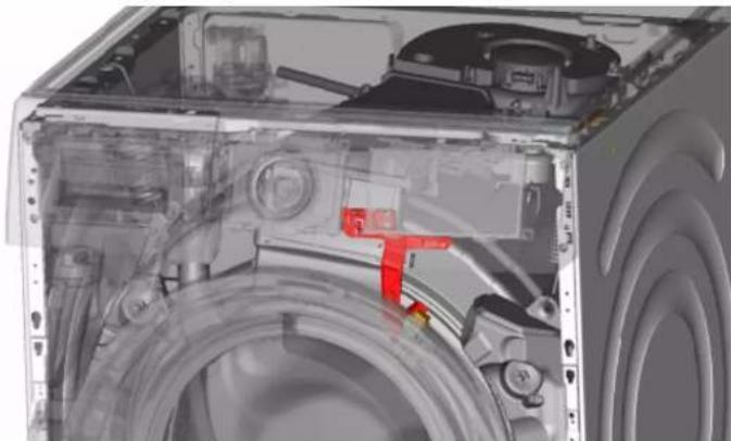 Interior view of a washing machine showing internal components like hoses and gauges (no text or labels visible)