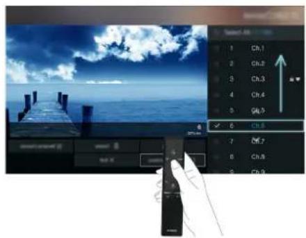 Screenshot of a video editing software interface showing a preview window with a blue sky and wooden pier, alongside a control panel with channel controls.