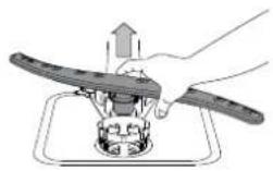 Diagram of a device with labeled parts A, C, and D, showing internal components and a hand holding a tool.