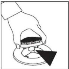 Diagram showing a hand holding a small object with Chinese text, possibly indicating a component or step in a process.