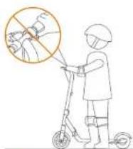 Illustration showing a person using a stroller with a hand gesture and a magnified inset of the object, likely indicating a safety or hazard scenario.