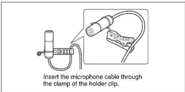 Insert the microphone cable through the clamp of the holder clip.