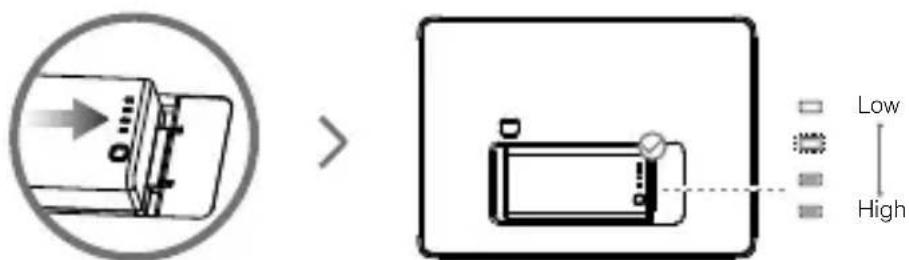 Diagram showing a device with directional arrow and a magnified view of a device with labeled dimensions (Low, High)