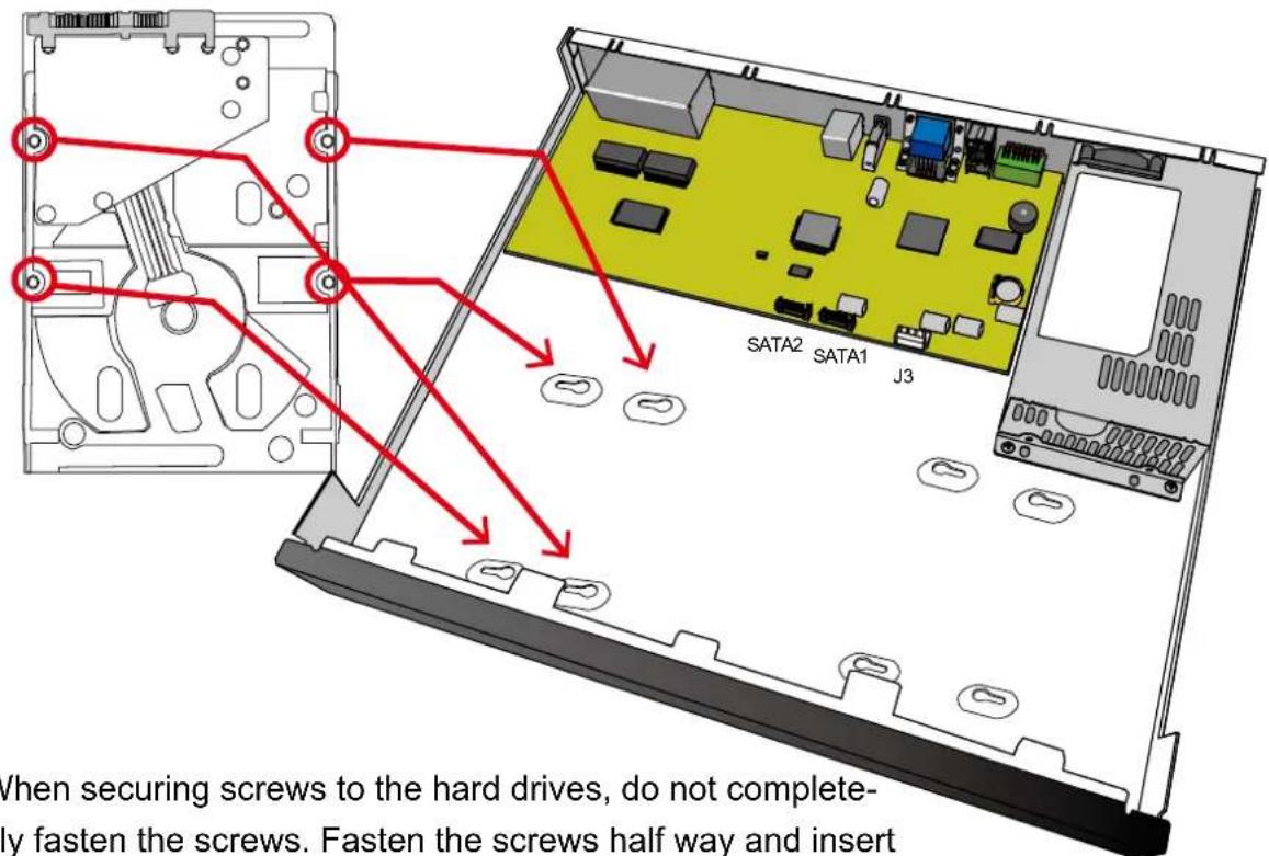 SATA2 SATA1 J3 When securing screws to the hard drives, do not completely fasten the screws. Fasten the screws half way and insert