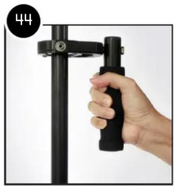 Hand holding a black mechanical lever against a white background (no text or symbols visible)