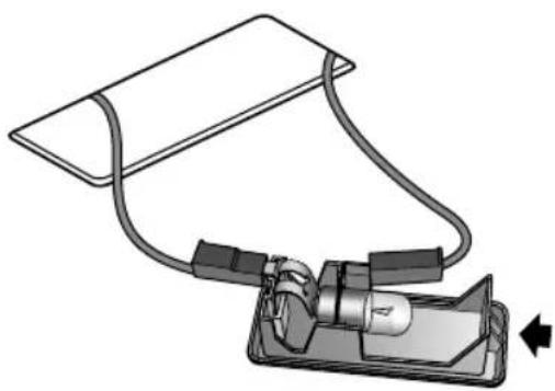 Diagram of a medical device with tubing and connector, showing internal components (no text or symbols)