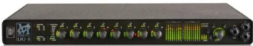 Front view of a black audio equipment unit labeled 'LIO 8' with multiple knobs and a green waveform display (no readable text beyond label)