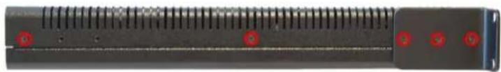 Close-up of a black electronic device with red indicator lights and ribbed top (no visible text or symbols)