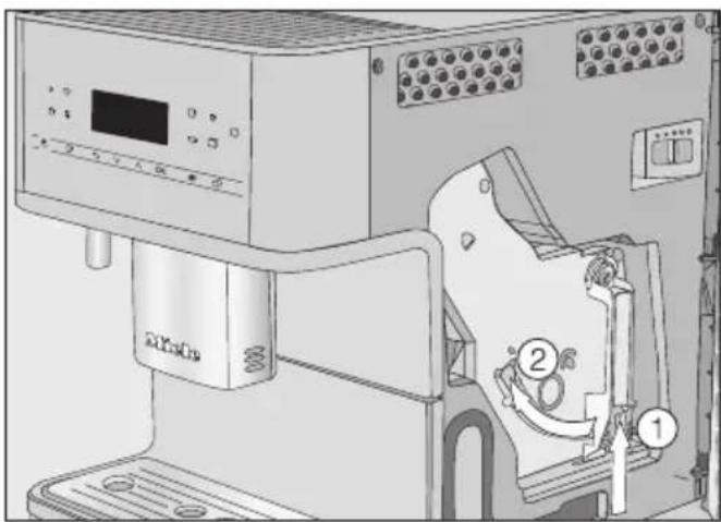 MIELE MilkPerfection CM 6560 - Bryggeenheden og det indvendige rum rengøres - 1