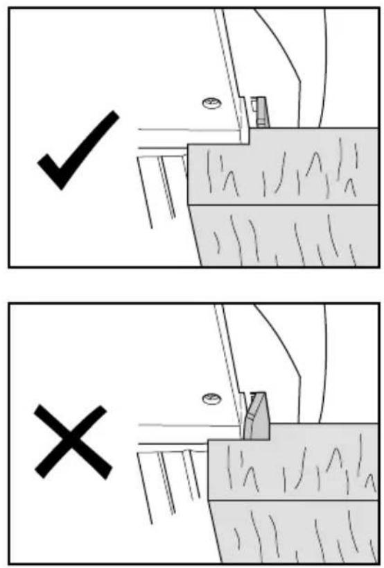 Technical diagram showing two mechanical assembly states with check and cross symbols indicating inspection or failure conditions.