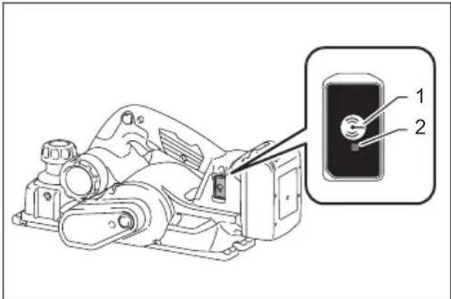 Technical diagram of a mechanical device with labeled parts, showing a close-up inset of a component with two numbered parts.
