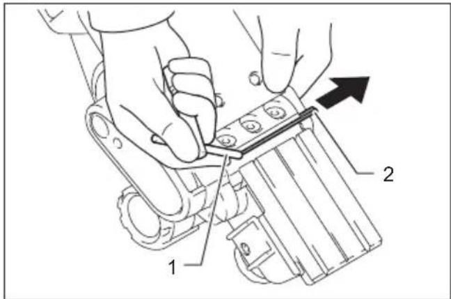 Technical diagram showing hands using a tool to adjust or install a mechanical component, labeled with parts 1 and 2.
