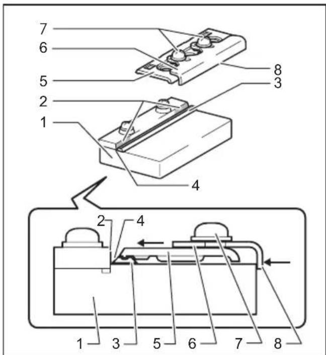 Technical diagram of a mechanical assembly with numbered components, likely an electrical or electronic component.