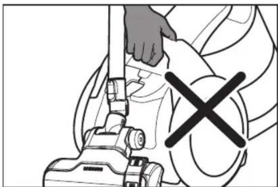 Line drawing of a person using a vacuum cleaner with a cross symbol (no text or labels)