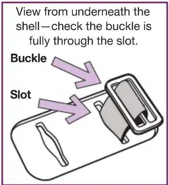 View from underneath the shell—check the buckle is fully through the slot. Buckle Slot
