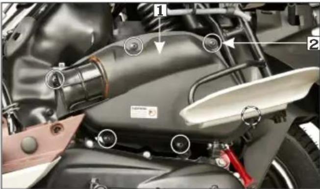Labeled mechanical assembly diagram showing components of a motorcycle engine with numbered parts and circular annotations
