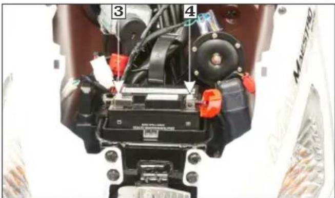 Close-up of a mechanical assembly with numbered components, likely a vehicle or motor component, showing labeled parts 3 and 4.