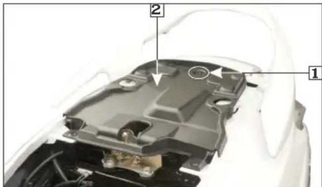 Technical diagram of a car engine compartment with numbered annotations pointing to components