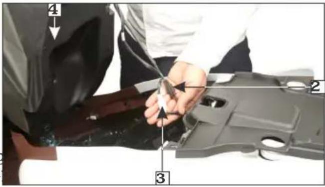 Labeled photo of a person using a tool to adjust or install a mechanical component, with numbered annotations pointing to parts 1, 2, and 3.