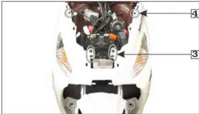 Technical diagram of a motorcycle's head with labeled parts, showing engine and mechanical components
