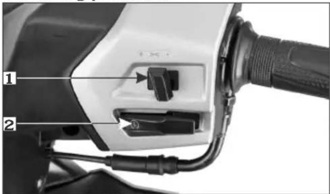Close-up of an electric vehicle charging plug with labeled parts 1 and 2