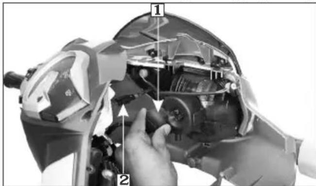 Technical diagram showing hands assembling a motorcycle component with numbered parts labeled 1 and 2